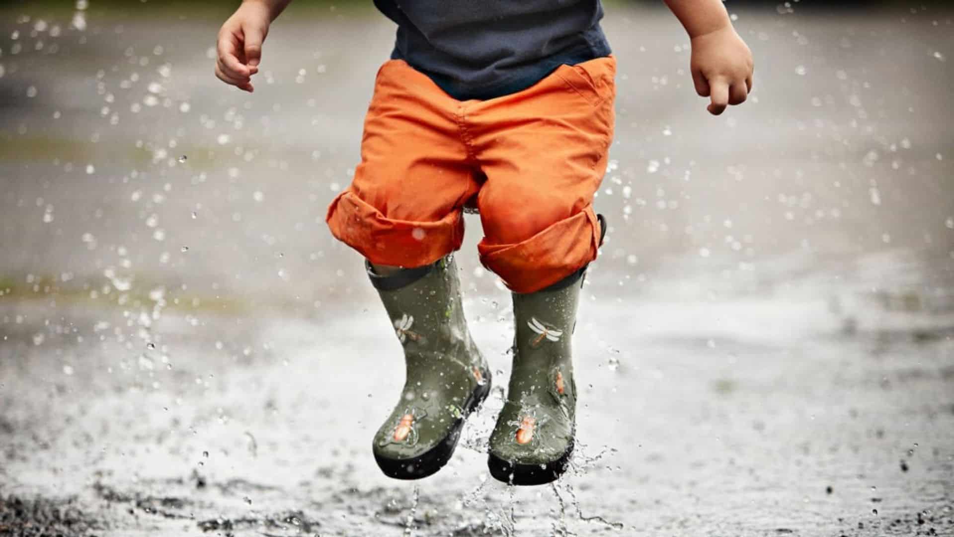 kids are jumping in Puddles