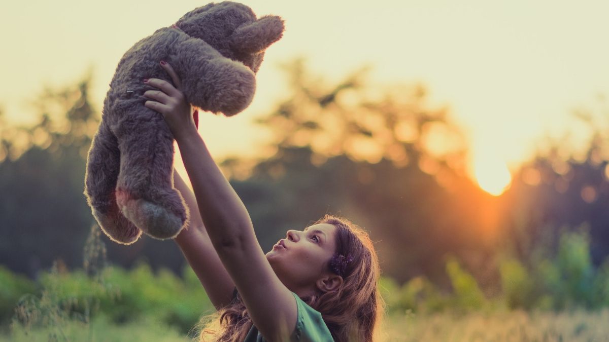 Guy is giving teddy bear as a gift